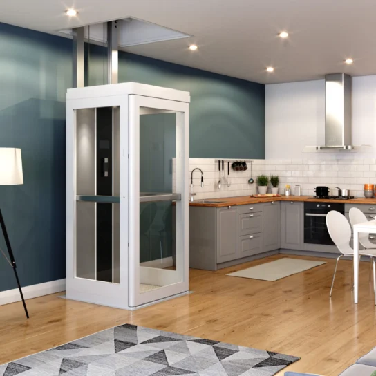 Modern kitchen and living area with wooden floors, featuring a home elevator, a tripod floor lamp, and contemporary furniture.