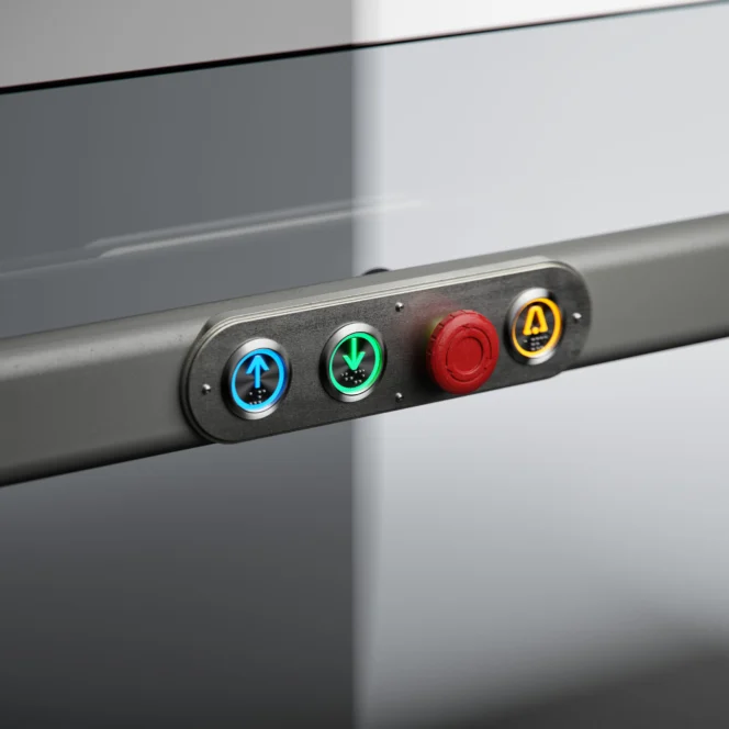 A control panel with three illuminated buttons for up, down, and automatic functions, and one large red emergency stop button.