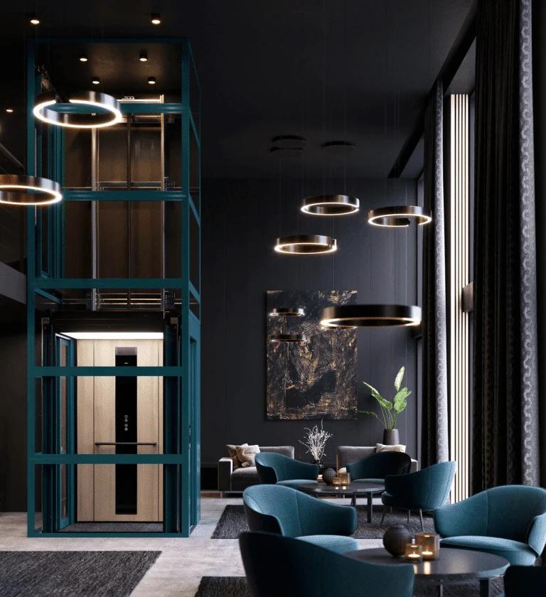 Modern lounge with teal velvet chairs, circular pendant lights, and a glass-walled elevator at the center, featuring dark walls and tall windows letting in natural light.