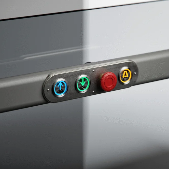 A control panel with blue up, green down, red emergency stop, and yellow automatic buttons mounted on a metallic surface.