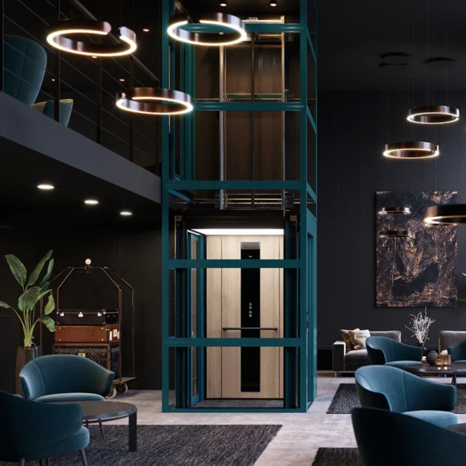 A modern, glass-walled elevator in a stylish, dark-toned hotel lobby with blue chairs, ring lights, and contemporary decor.