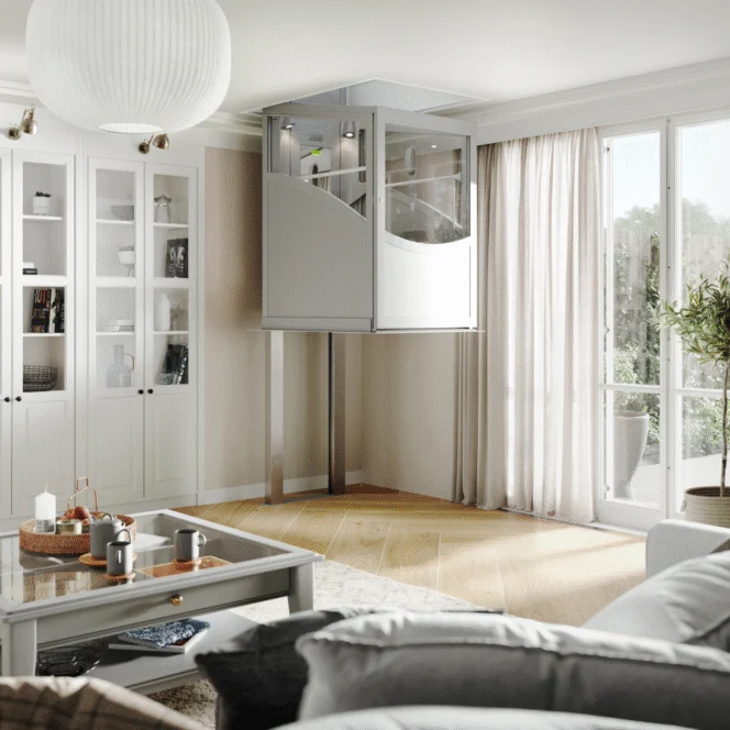 A modern residential living room featuring a compact, glass-enclosed home elevator next to large windows with sheer curtains.
