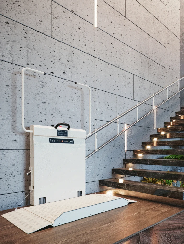 A stair lift platform for wheelchair access is installed beside a modern staircase with illuminated steps and a textured concrete wall.